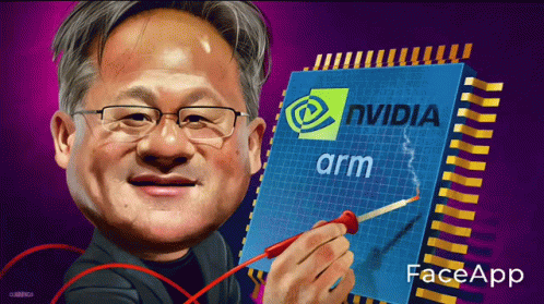 Man With Glasses Holding Nvidia Arm Chip