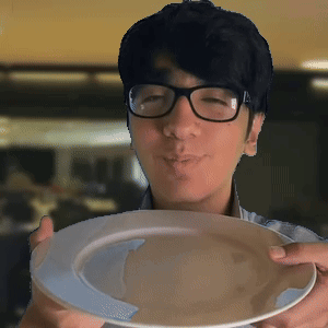 Man With Glasses Holding Plate