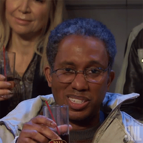 Man with Glasses Holding Soda with Straw 2021