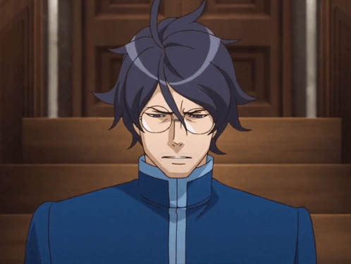Man With Glasses in Blue Jacket Looking at Camera