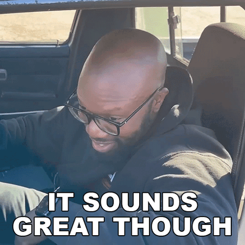 Man With Glasses in Car Saying It Sounds Great Though