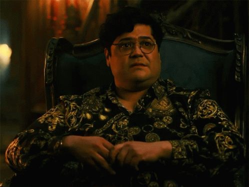 Man With Glasses in Chair Saying Shade