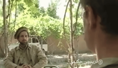 Man With Glasses In Front Of Afghanistan Flag GIF