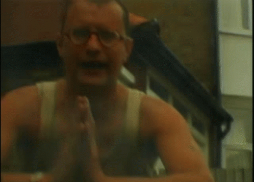 Man With Glasses In Front Of House GIF