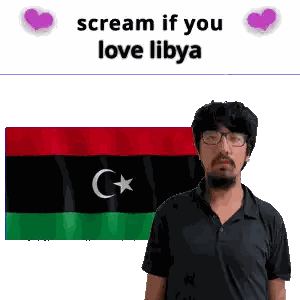 Man with Glasses in Front of Libya Flag