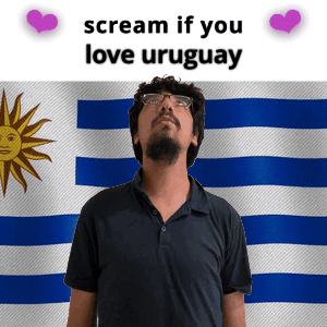 Man With Glasses in Front of Uruguay Flag
