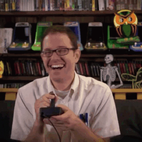 Man With Glasses Laughing With Controller GIF