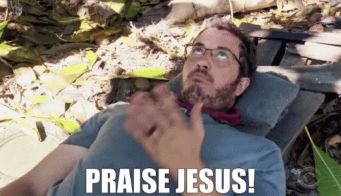 Man With Glasses Laying Down Praise Jesus