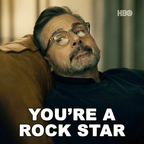 Man With Glasses Laying on Couch You're a Rock Star