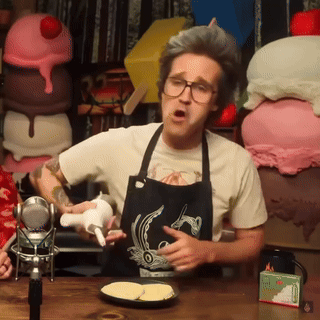 Man With Glasses Looking At Camera GIF