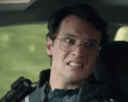 Man With Glasses Making Funny Face in Car