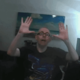 Man With Glasses Making Funny Face With Hands