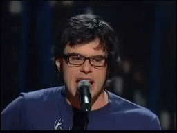 Man With Glasses Microphone Saying Is That It