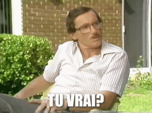 Man with Glasses Mustache Brick House Saying Tu Vrai