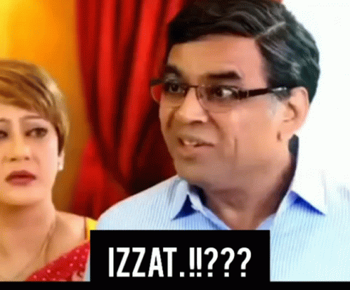 Man with Glasses Next to Woman and Izzat Sign