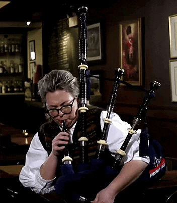 Man With Glasses Playing Bagpipes Saying Scottish