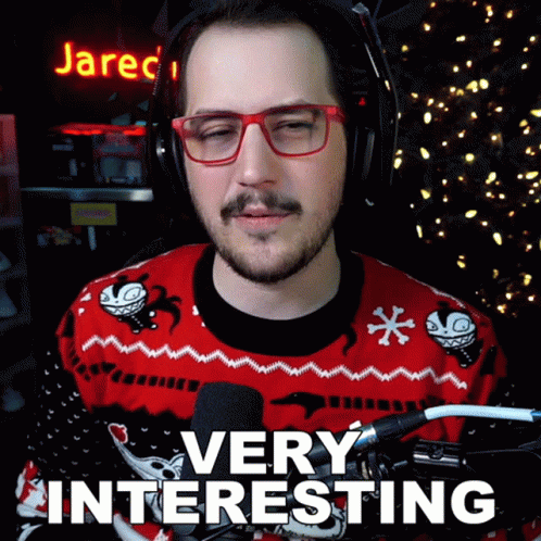 Man with Glasses Red Sweater Saying Very Interesting