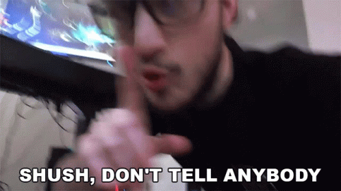Man with Glasses Saying Shush