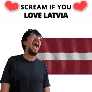 Man With Glasses Screaming in Front of Latvian Flag