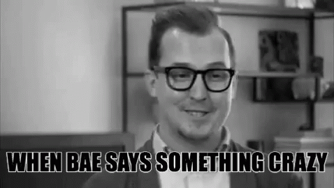 Man With Glasses Smiling In Black And White Photo GIF