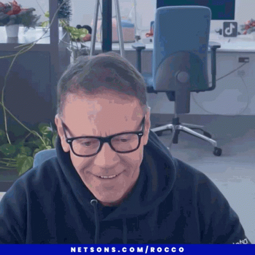 Man with Glasses Smiling Netsons.com Rocco Ad