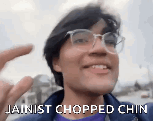 Man With Glasses Smiling Saying Jainist Chopped Chin