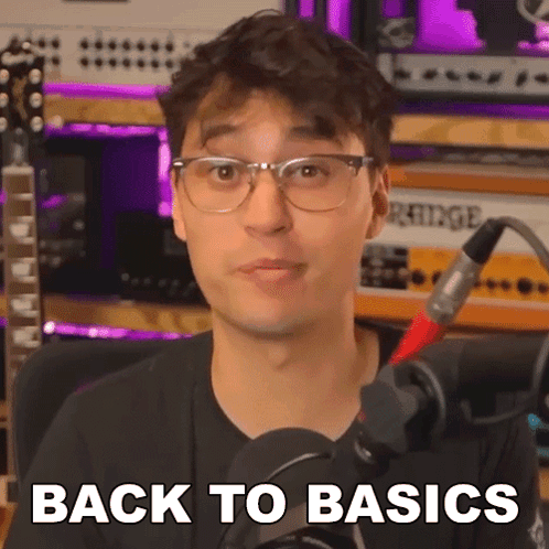 Man With Glasses Talking Into Microphone Back to Basics
