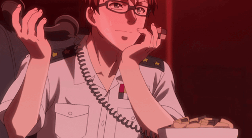 Man With Glasses Talking on Phone With Cookies