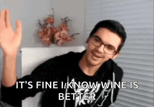 Man with Glasses Waving and Saying It's Fine