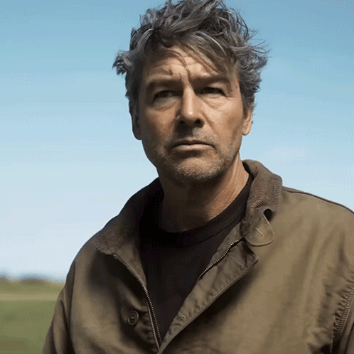 Man With Gray Hair And Beard In Green Jacket GIF