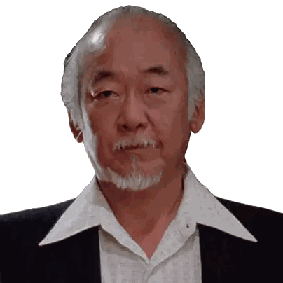 Man with Gray Hair and Beard in White Shirt and Black Suit
