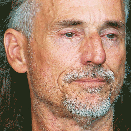 Man With Gray Hair and Beard Looking at Camera