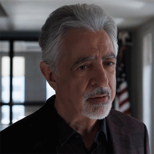 Man With Gray Hair and Beard Looks Serious
