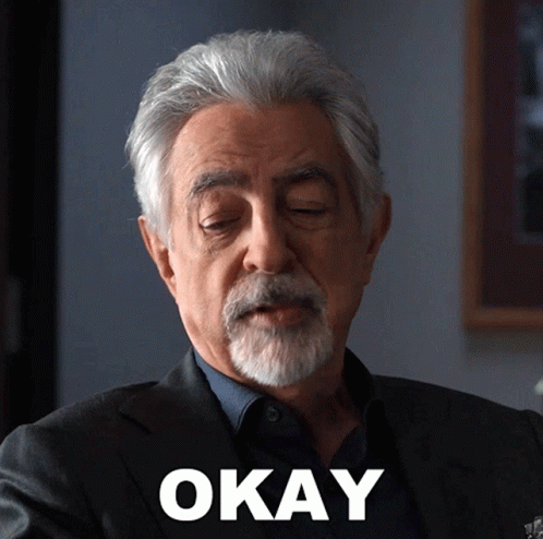 Man With Gray Hair and Beard Says Okay