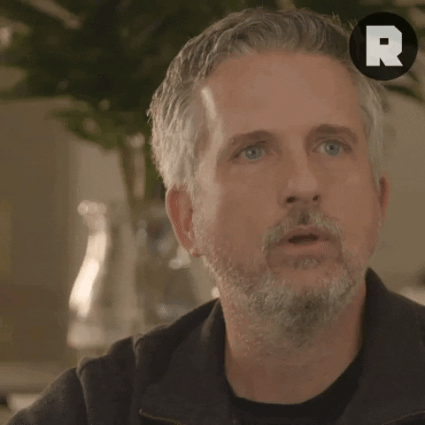 Man with Gray Hair and Beard with R on Head