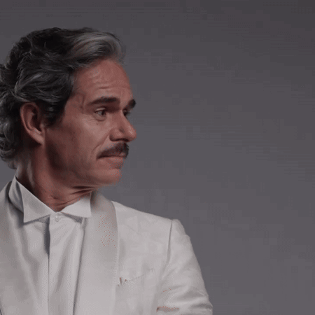 Man with Gray Hair and Mustache in White Jacket