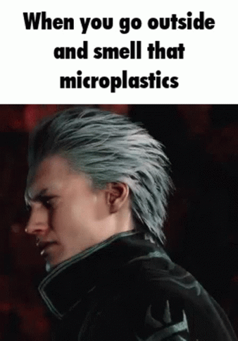 Man With Gray Hair Smelling Microplastics In Dark GIF