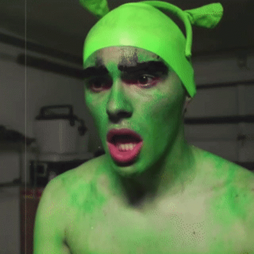 Man with Green Face Paint and Hat