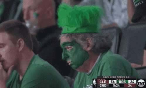 Man With Green Face Paint Watching Game GIF