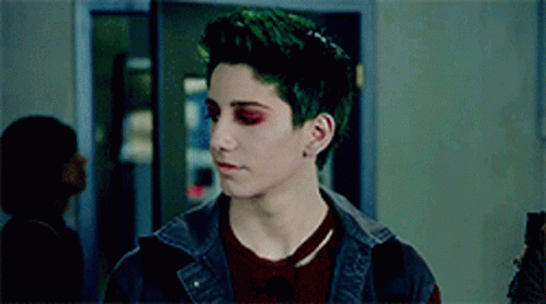Man With Green Hair and Red Eyes in Hallway