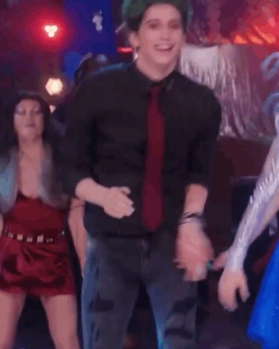Man With Green Hair and Red Tie Dancing
