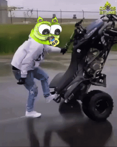 Man With Green Head Riding Four Wheeled Vehicle Cross Bit Me