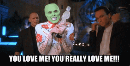 Man With Green Mask Holding Trophy Saying You Love Me You Really Love Me!!!