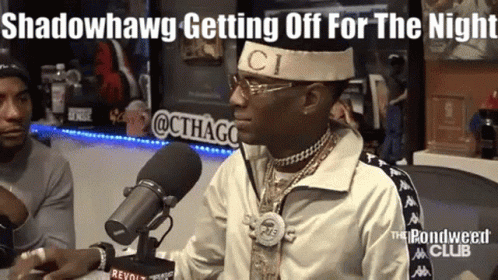 Man With Gucci Headband at Microphone