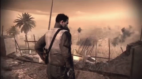 Man With Gun on Back in Field