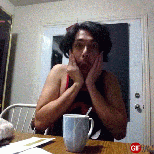 Man With Hands On Face And Coffee GIF