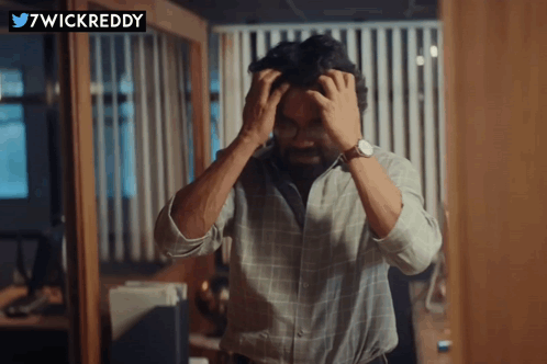 Man With Hands On Head And 7Wickreddy Logo GIF