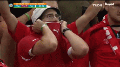 Man With Hat and Glasses Covering Face