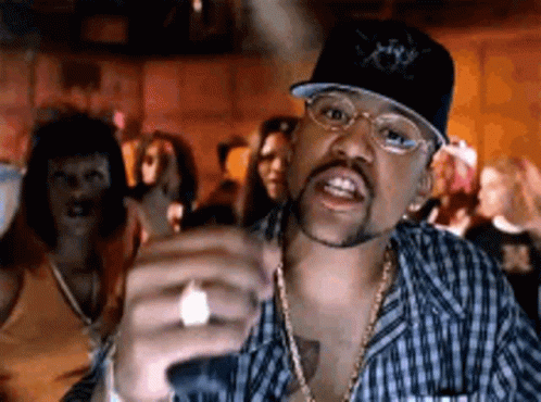 Man With Hat And Glasses In Front Of Group GIF