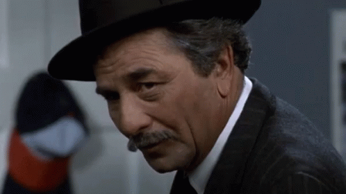 Man With Hat And Mustache Looking Down GIF